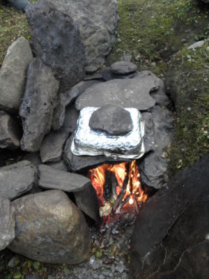 preparing some fish on hot stones